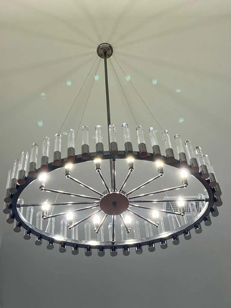 A lit LED ring chandelier seen from below